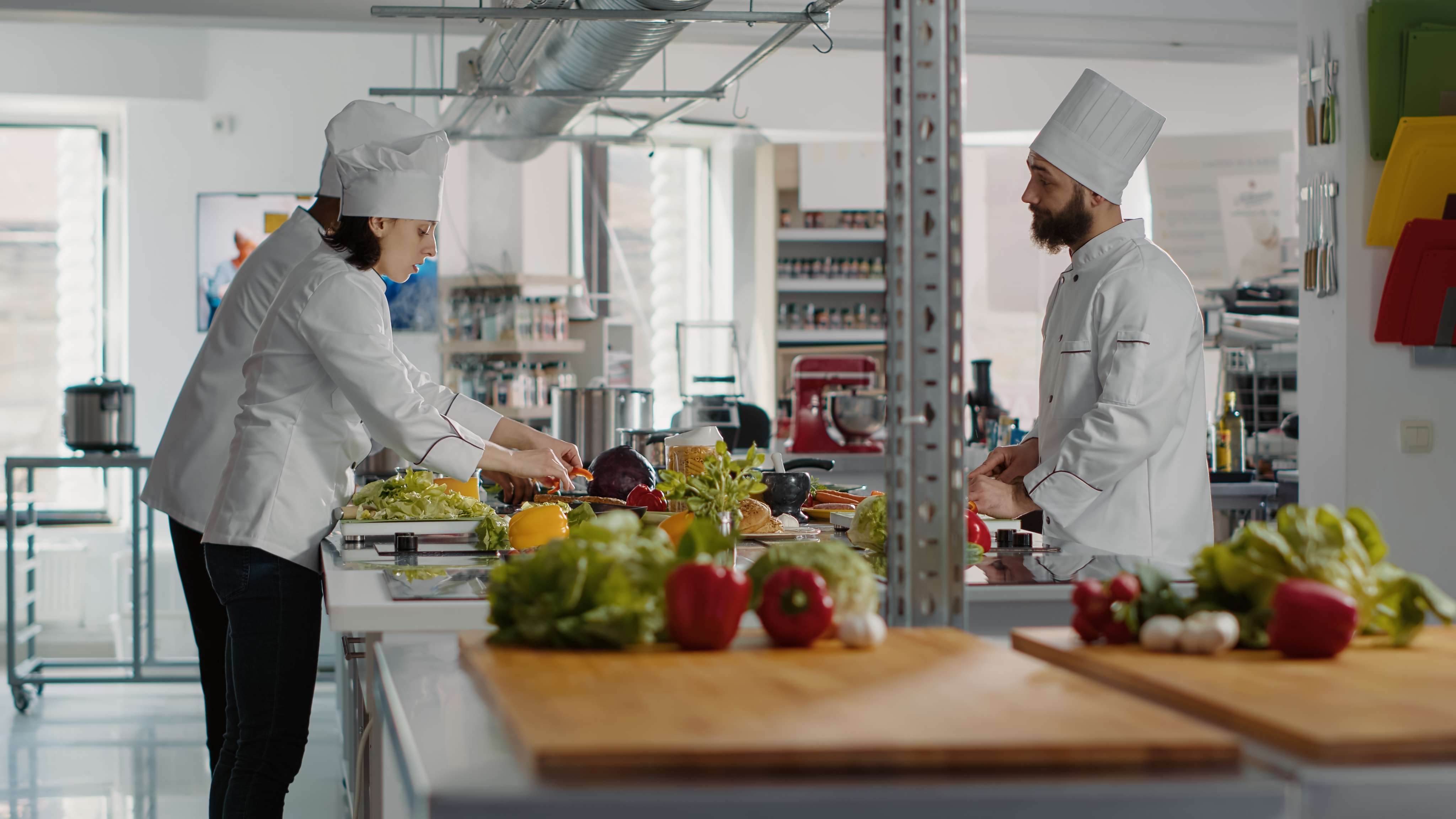Professional chefs preparing organic ingredients in our modern kitchen